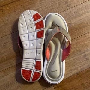 Women’s Nike flip flops size 11 worn once.